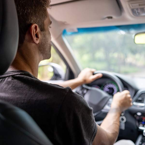 Driver in a vehicle protected with auto and comprehensive insurance service in Grand Junction, CO