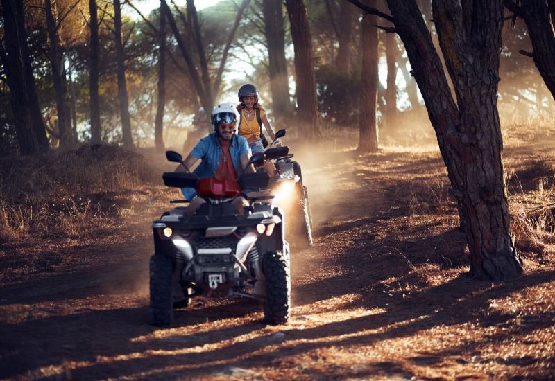 Two people enjoy an off-roading adventure on an ATV in the Grand Junction Area