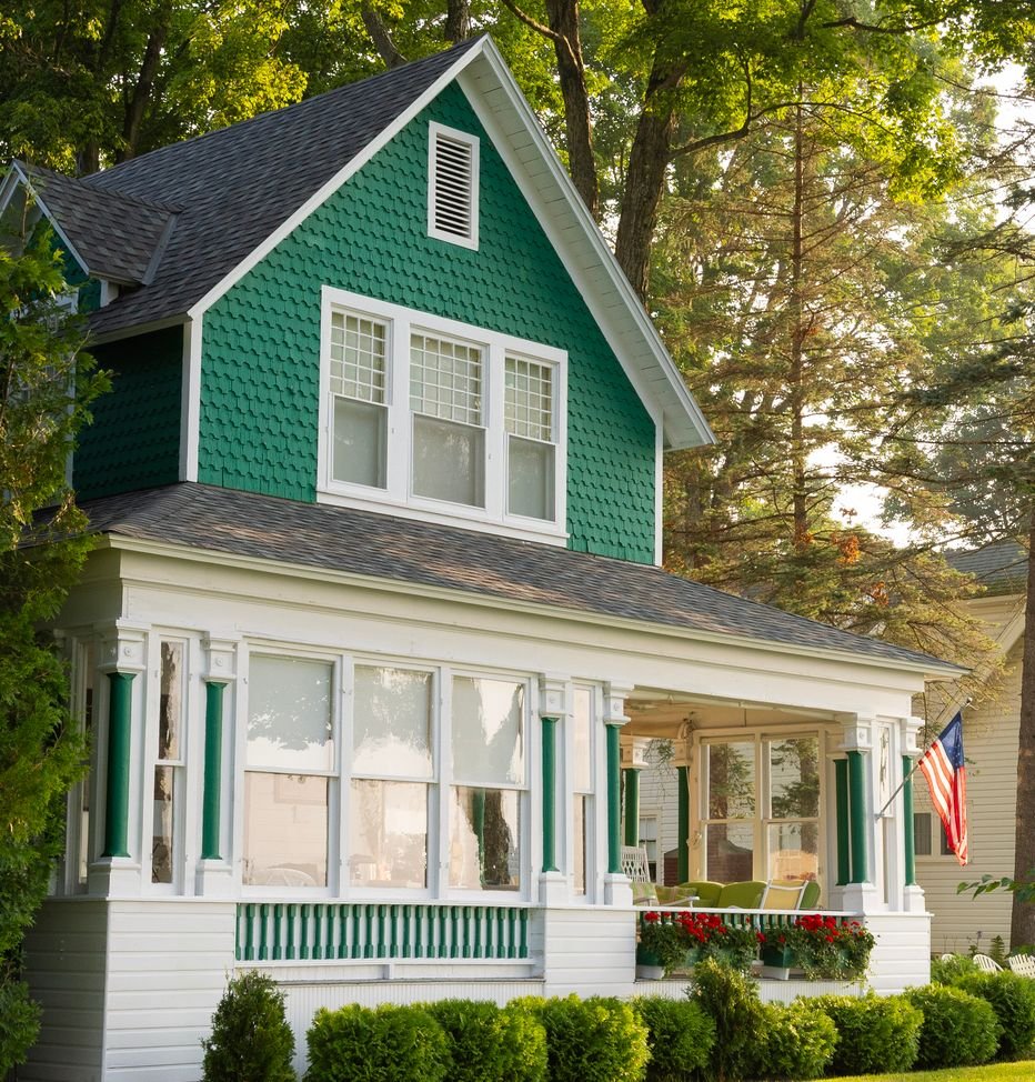 Green home exterior supported by homeowners' insurance services in Grand Junction, CO